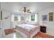 Charming bedroom with ceiling fan, white walls, and a bright window view at 3036 Rose St, Sarasota, FL 34239