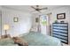 Calm bedroom with soft natural light, a ceiling fan, and spacious closet at 3036 Rose St, Sarasota, FL 34239