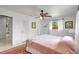 This bedroom features a ceiling fan, closet, and a window view of the backyard at 3036 Rose St, Sarasota, FL 34239