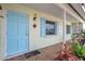 Charming home with a covered entry way and bright blue door at 3036 Rose St, Sarasota, FL 34239