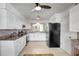 Bright kitchen featuring granite countertops, stainless steel appliances and white cabinetry at 3036 Rose St, Sarasota, FL 34239