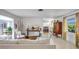 Bright living room with light colored couches and a modern entertainment center at 3036 Rose St, Sarasota, FL 34239