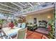 Relaxing screened in patio with comfortable seating and views of the backyard at 3036 Rose St, Sarasota, FL 34239
