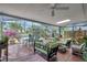Relaxing screened in patio with comfortable seating and views of the lush backyard at 3036 Rose St, Sarasota, FL 34239