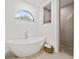 Bright bathroom featuring freestanding tub, pebble floor, and large walk-in shower at 3415 162Nd E Ave, Parrish, FL 34219