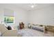 Bright bedroom featuring a chair, white walls, and natural light at 3415 162Nd E Ave, Parrish, FL 34219