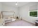 bedroom featuring wooden bedframe, decorative pillows, and natural light at 3415 162Nd E Ave, Parrish, FL 34219