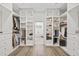 Walk-in closet with extensive built-ins at 3415 162Nd E Ave, Parrish, FL 34219
