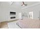 Spacious main bedroom boasts wood floors, fireplace, and ensuite at 3415 162Nd E Ave, Parrish, FL 34219