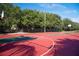 Outdoor basketball court surrounded by trees, perfect for recreational games at 356 Blackbird Ct, Bradenton, FL 34212