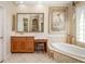 Bathroom featuring jacuzzi tub, vanity area, and decorative lighting at 356 Blackbird Ct, Bradenton, FL 34212