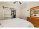 Bedroom with a bed, wooden dresser, and closet with a sliding barn door at 356 Blackbird Ct, Bradenton, FL 34212
