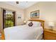 Cozy bedroom with a queen-size bed, natural light, and window views at 356 Blackbird Ct, Bradenton, FL 34212