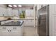 Bright kitchen with white cabinets, stainless steel appliances, and a spacious island at 356 Blackbird Ct, Bradenton, FL 34212