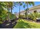 Lush backyard landscaping enhances privacy near the screened lanai of this home at 356 Blackbird Ct, Bradenton, FL 34212