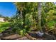 Mature landscaping and mulch create a tranquil garden space at 356 Blackbird Ct, Bradenton, FL 34212