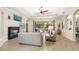 Open-concept living room with seamless flow to the outdoor patio and pool area with modern décor at 356 Blackbird Ct, Bradenton, FL 34212