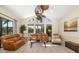 Bright living room boasts tan couches, high ceilings, and large windows with water views at 356 Blackbird Ct, Bradenton, FL 34212