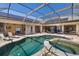 Resort-style pool and spa with expansive screened patio, ideal for relaxation and entertainment at 356 Blackbird Ct, Bradenton, FL 34212