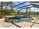 Enclosed pool area with waterfall, water feature, and lounge chairs at 356 Blackbird Ct, Bradenton, FL 34212