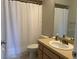Bathroom featuring vanity, toilet, and shower behind a white curtain at 3602 Bonaventure Ct, Sarasota, FL 34243