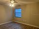 Bright bedroom featuring a ceiling fan and a window for natural light at 3602 Bonaventure Ct, Sarasota, FL 34243