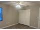 Bedroom with hardwood flooring featuring a window and a closet at 3602 Bonaventure Ct, Sarasota, FL 34243