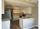 Modern Kitchen featuring stainless steel appliances, white cabinetry, and a double sink at 3602 Bonaventure Ct, Sarasota, FL 34243