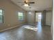 Spacious living room with vaulted ceiling, ceiling fan, pendant light, and access to the kitchen at 3602 Bonaventure Ct, Sarasota, FL 34243