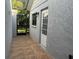 The outdoor patio is tiled with a partial view of the lawn at 3602 Bonaventure Ct, Sarasota, FL 34243