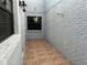 The patio features tiled flooring, brick walls, and a small window at 3602 Bonaventure Ct, Sarasota, FL 34243