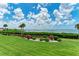Expansive backyard offers a manicured lawn, decorative rock garden, and unobstructed water views at 3803 Sun Eagle Ln # 203, Bradenton, FL 34210