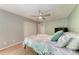 Bright bedroom with a ceiling fan, spacious closet, and a charming coastal-themed bedspread at 3803 Sun Eagle Ln # 203, Bradenton, FL 34210