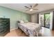 Comfortable bedroom with balcony, ceiling fan, and a dresser at 3803 Sun Eagle Ln # 203, Bradenton, FL 34210