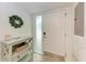 Bright foyer featuring a modern entry door with glass and a convenient console table at 3803 Sun Eagle Ln # 203, Bradenton, FL 34210