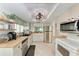 Well-lit kitchen featuring stainless steel appliances, wooden countertops, and bright white cabinets and walls at 3803 Sun Eagle Ln # 203, Bradenton, FL 34210