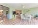 Inviting lanai with glass table and arcade game at 3803 Sun Eagle Ln # 203, Bradenton, FL 34210