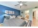 Comfortable bedroom featuring ensuite bathroom, a seating area, and ample natural light at 3803 Sun Eagle Ln # 203, Bradenton, FL 34210
