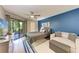 Cozy bedroom with private balcony access, and neutral décor at 3803 Sun Eagle Ln # 203, Bradenton, FL 34210