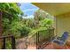 Inviting patio with seating overlooks the lush tropical landscaping at 3803 Sun Eagle Ln # 203, Bradenton, FL 34210