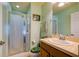 Bathroom with glass-enclosed shower and a modern single sink vanity at 3909 45Th W Ter # 102, Bradenton, FL 34210