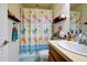 Well-organized bathroom with a flip-flop themed shower curtain at 3909 45Th W Ter # 102, Bradenton, FL 34210