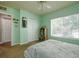 Bright bedroom features a ceiling fan, large window, and a comfortable bed at 3909 45Th W Ter # 102, Bradenton, FL 34210