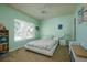 Bright bedroom featuring a ceiling fan, large window, and a comfortable bed at 3909 45Th W Ter # 102, Bradenton, FL 34210