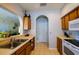 Spacious kitchen with an open layout, featuring wood cabinets, appliances, and a convenient breakfast bar at 3909 45Th W Ter # 102, Bradenton, FL 34210