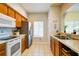 Functional kitchen features classic cabinets, modern appliances, and bright tile flooring at 3909 45Th W Ter # 102, Bradenton, FL 34210