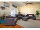 Comfortable living room with plush sofas, a stylish ceiling fan, and warm, inviting decor at 3909 45Th W Ter # 102, Bradenton, FL 34210