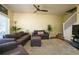 Comfortable living room features plush furniture, ceiling fan, and staircase access at 3909 45Th W Ter # 102, Bradenton, FL 34210