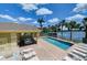 Pool area with tables, chairs, lounge seating, and gorgeous lake views in this serene community at 3909 45Th W Ter # 102, Bradenton, FL 34210