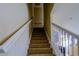 Carpeted staircase with white railing leading to the upper level at 3909 45Th W Ter # 102, Bradenton, FL 34210